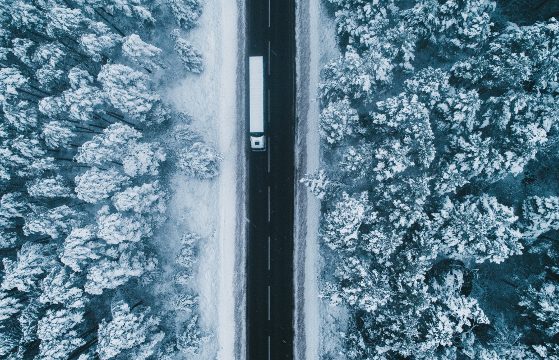 overhead shot of rural road in snow